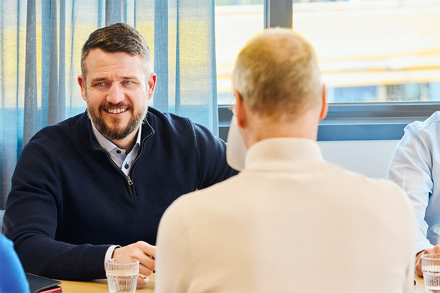 Business professionals in meeting discussing project and collaboration
